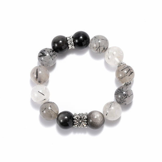 A natural bracelet made of black hair crystal and silver rays