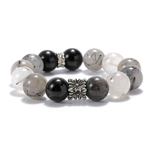 A natural bracelet made of black hair crystal and silver rays