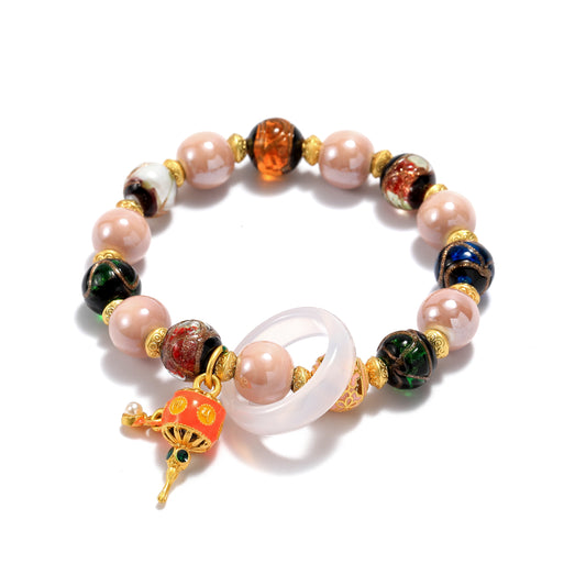 A bracelet with ceramic and glass