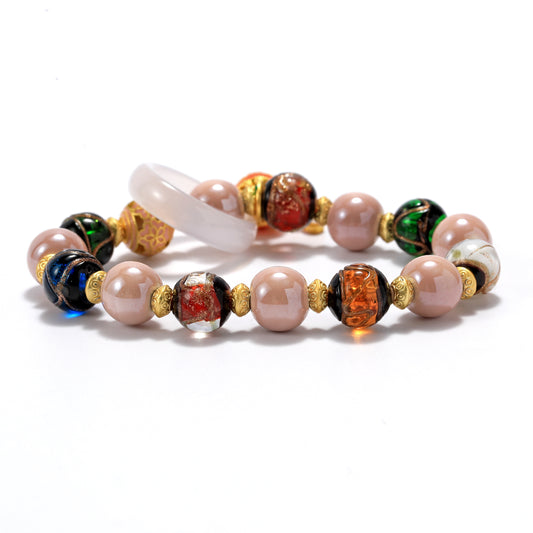 A bracelet with ceramic and glass